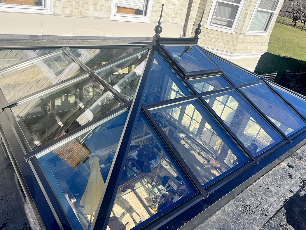 Straight eave double pitch hip-end skylight with ridge vents