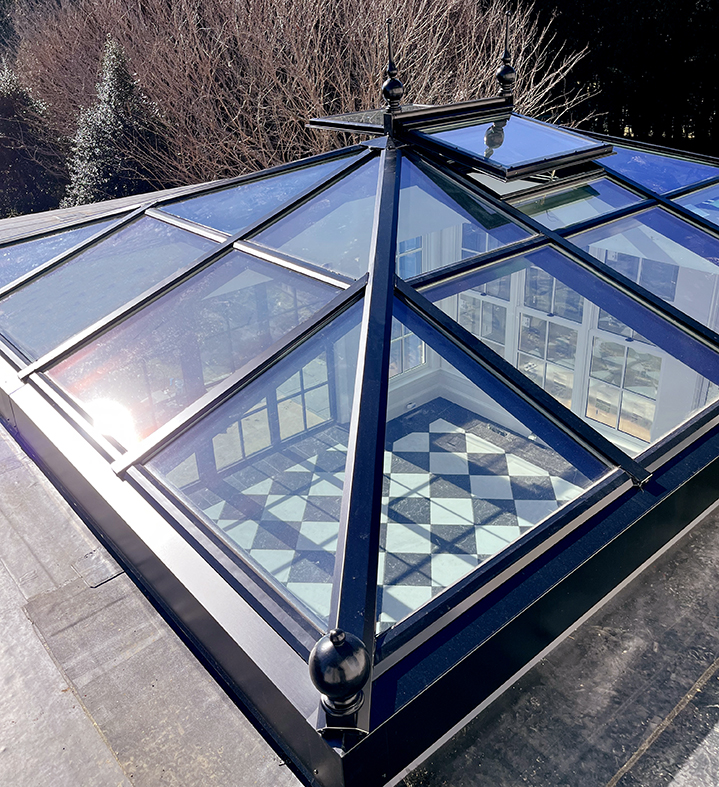Straight eave double pitch hip-end skylight with ridge vents