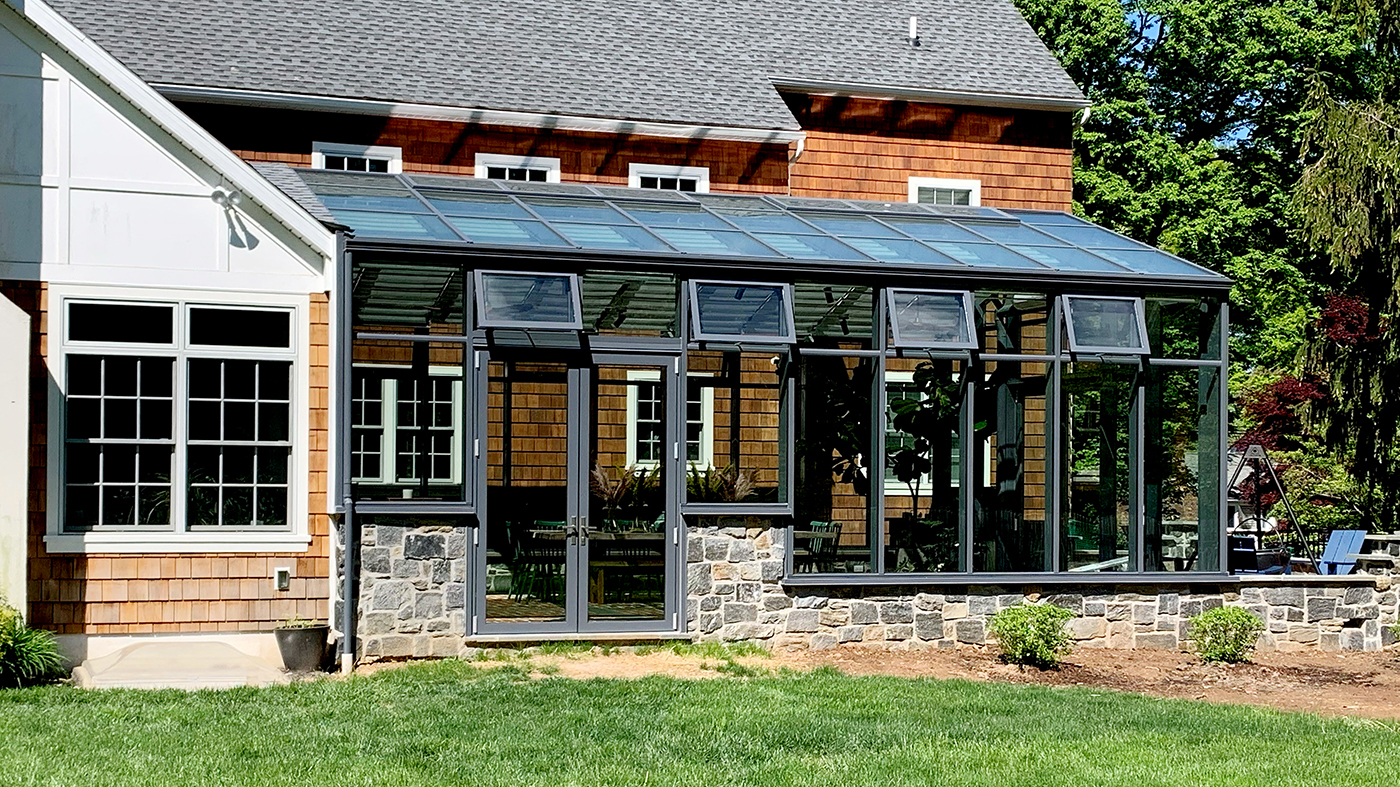 Straight eave double pitch conservatory with two sets of French doors