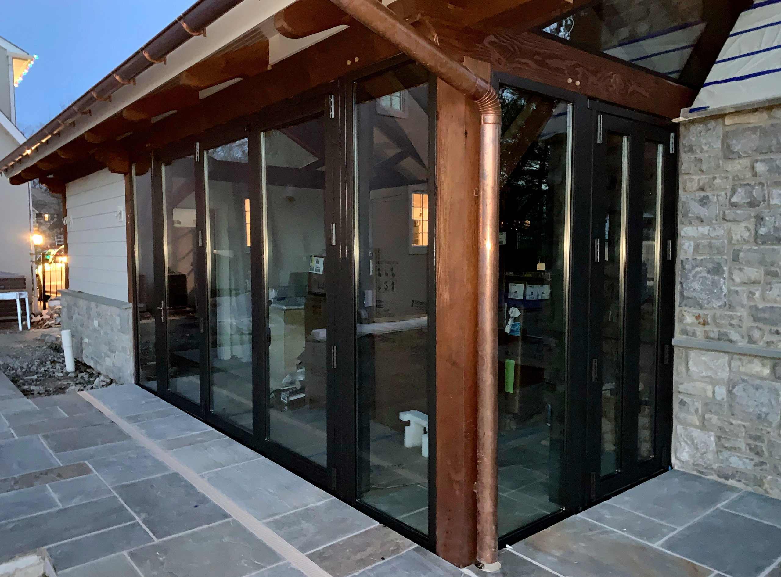 Four sets of bifold doors incorporated into a pool cabana