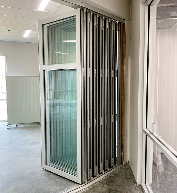 One 14-panel Single Door Hinged Jamb (SDHJ) Segmented Radius Bifold Door Unit with a Horizontal Mullion.