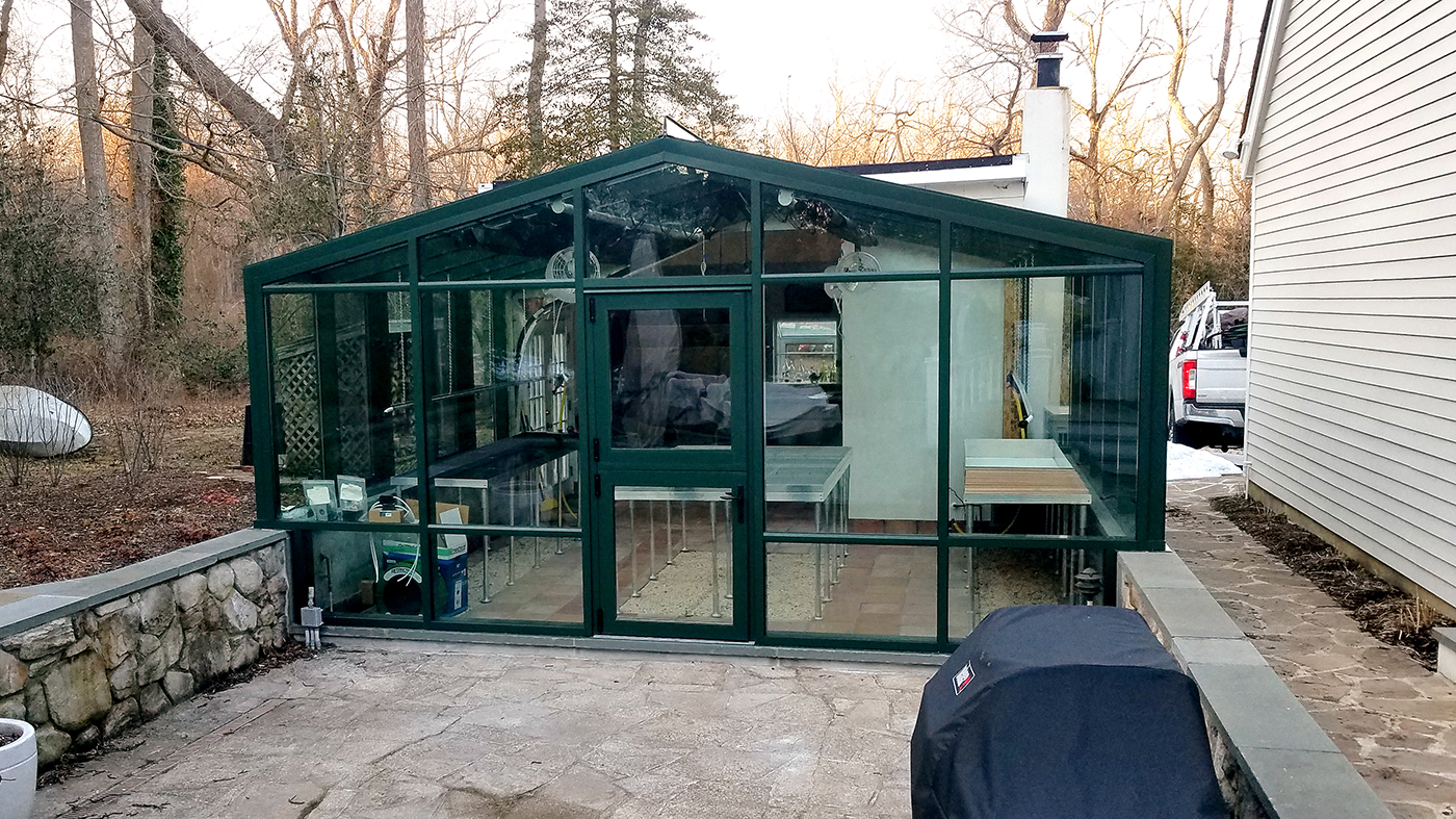 Straight eave double-pitch greenhouse with a Dutch Door