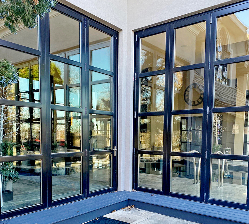 Two six-panel, two three-panel all-wall, one three-panel single door last panel (SDLP) G3LT outfold bifold door units, two French doors with sidelites, the French doors without sidelites, and one fixed window, all with horizontal mullions.
