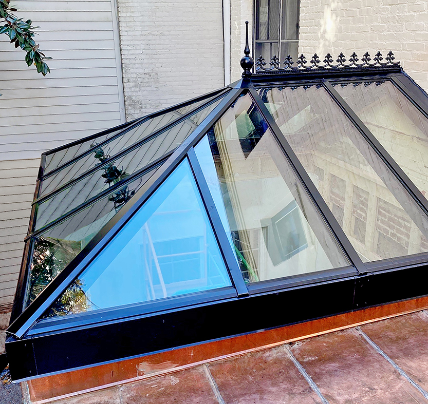 Straight eave double pitch hip-end skylight