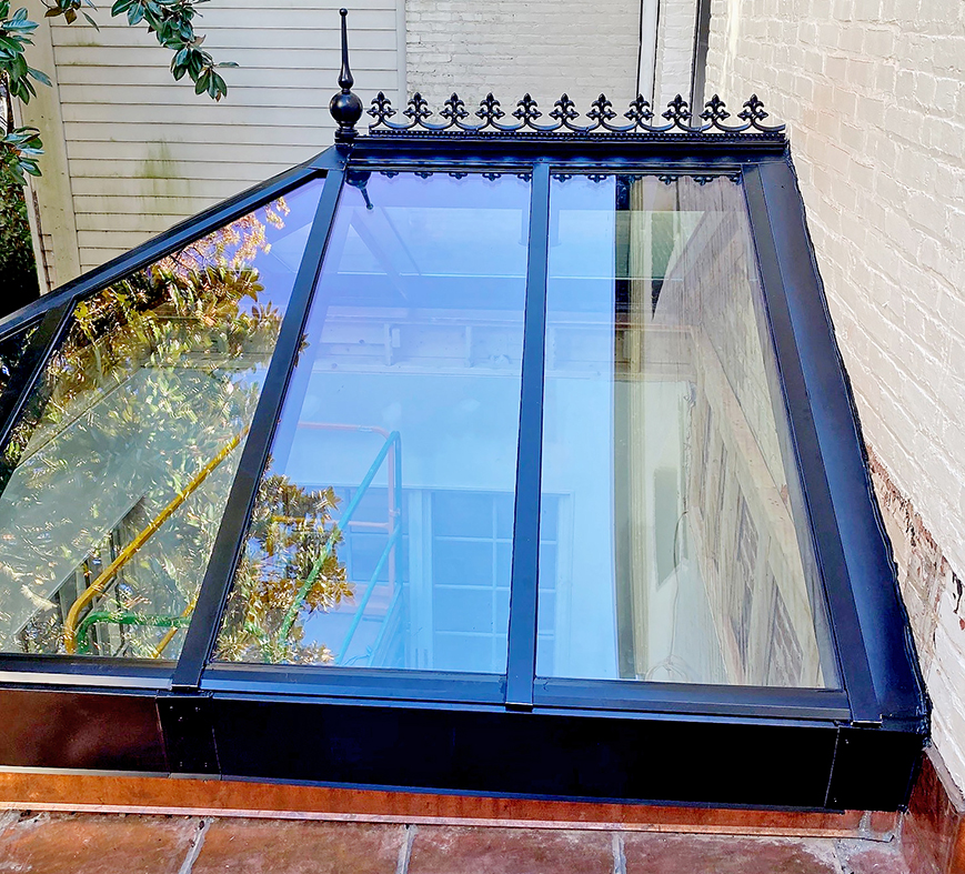 Straight eave double pitch hip-end skylight