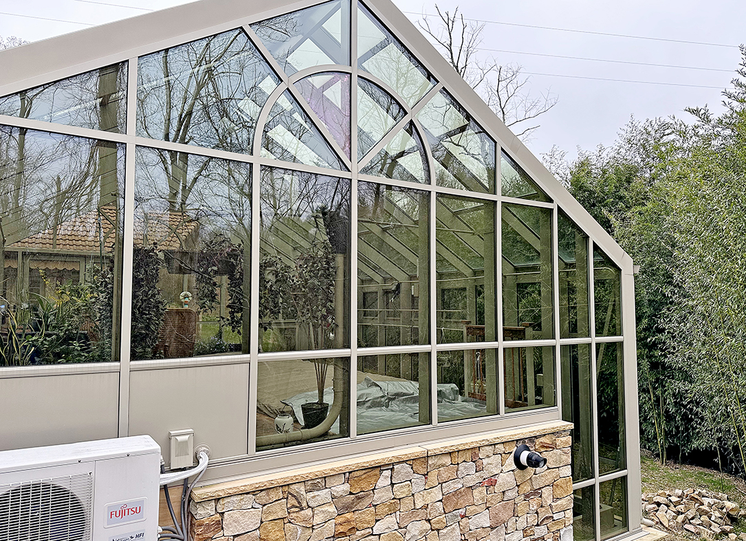 Straight eave double pitch two tier pool enclosure with bifold doors