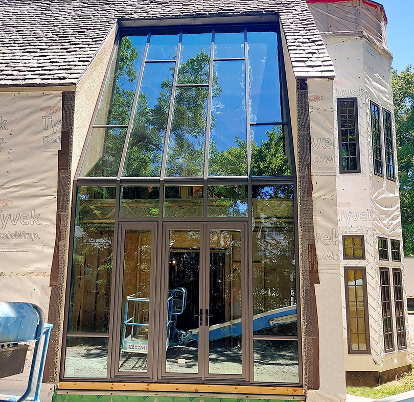 Straight eave lean-to sunroom with an integrated French Door.