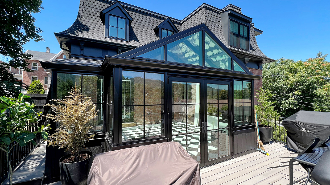 Straight eave lean-to conservatory  with a dormer, French doors and three awning windows