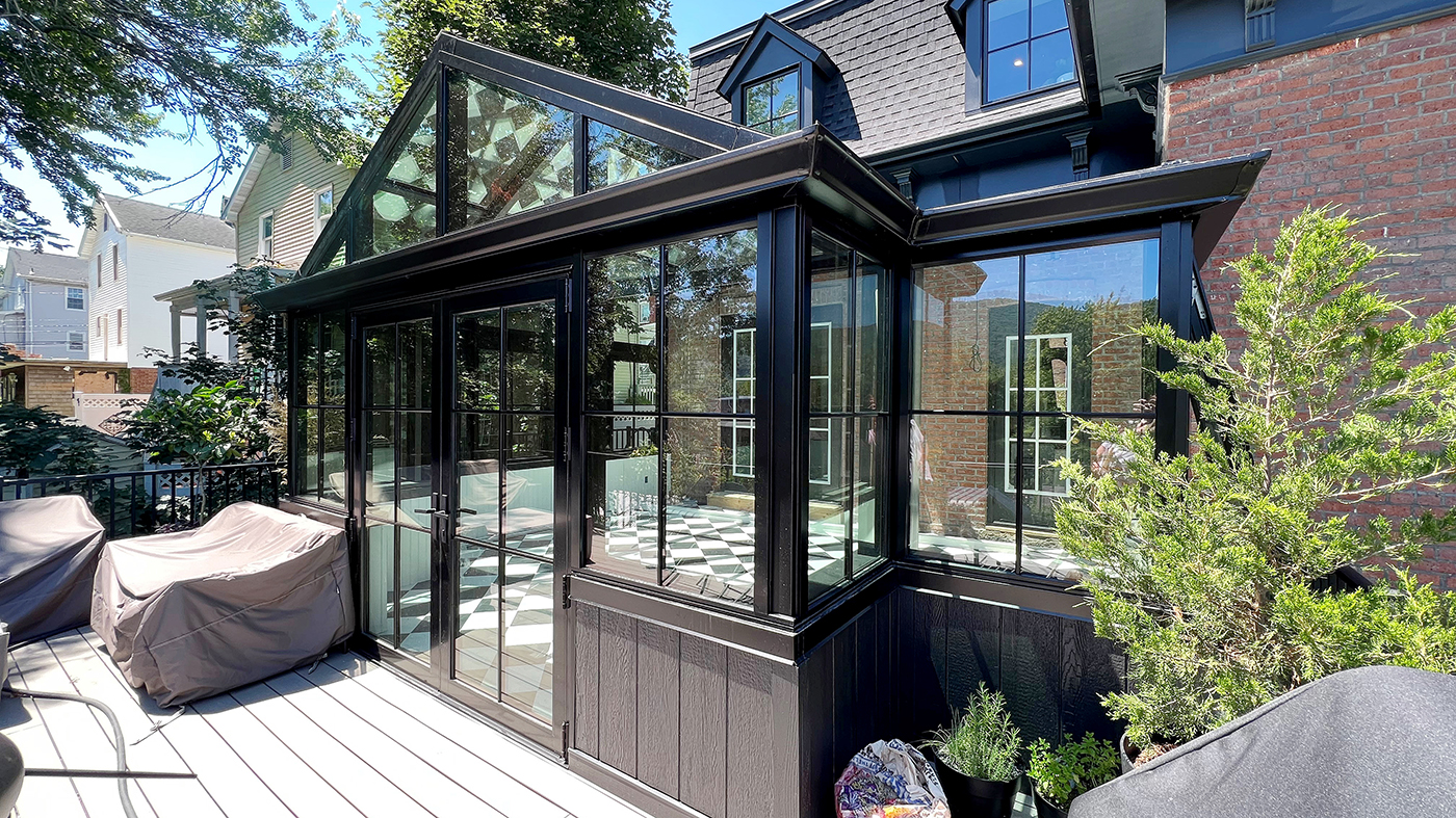 Straight eave lean-to conservatory  with a dormer, French doors and three awning windows
