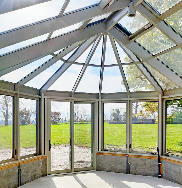 Straight eave double pitch  bullnose end sunroom with integrated sliding glass doors and sliding screens