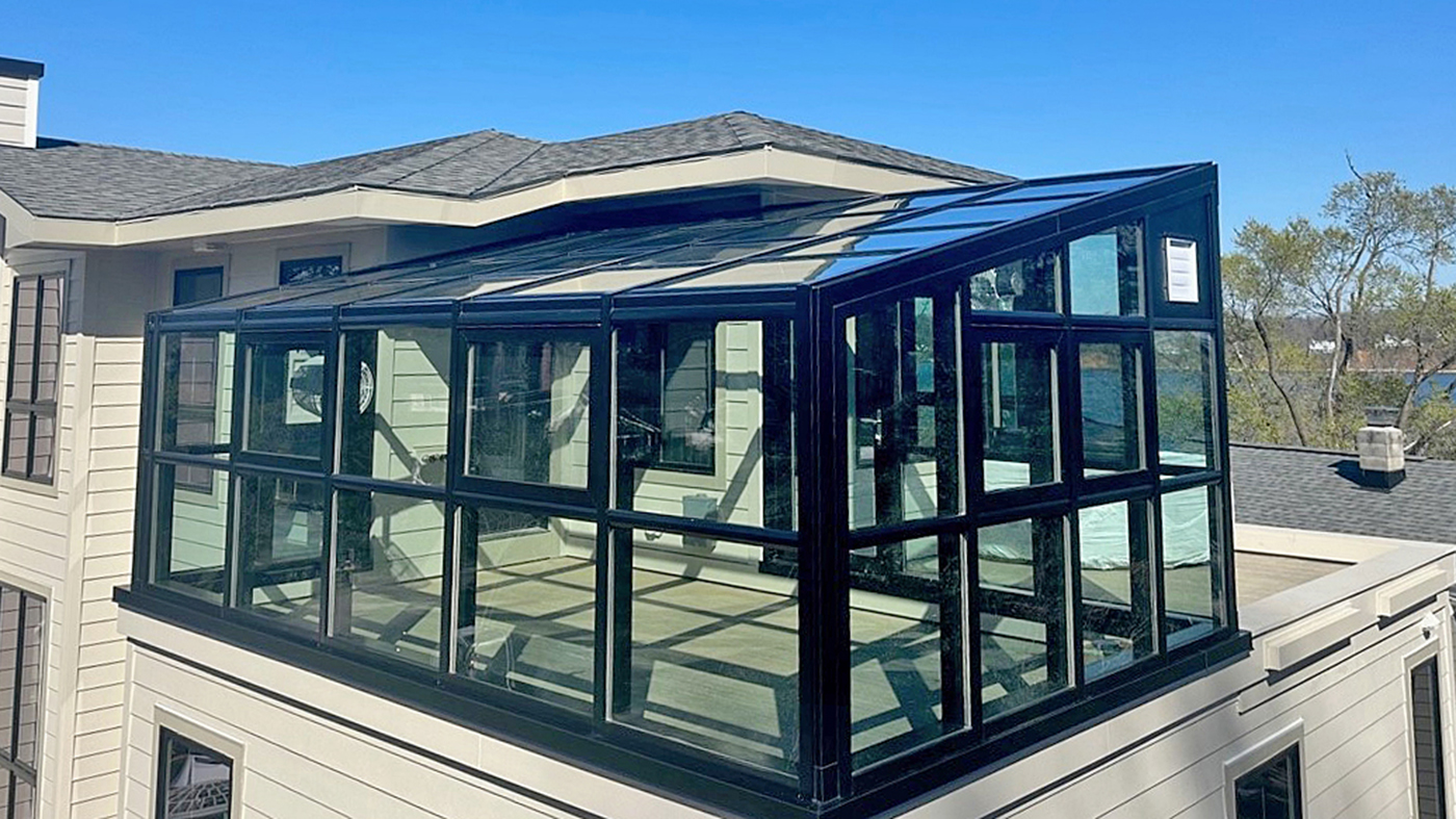 Straight eave lean-to greenhouse with an integrated swing door, awning windows, and solid panel infills for shutters.