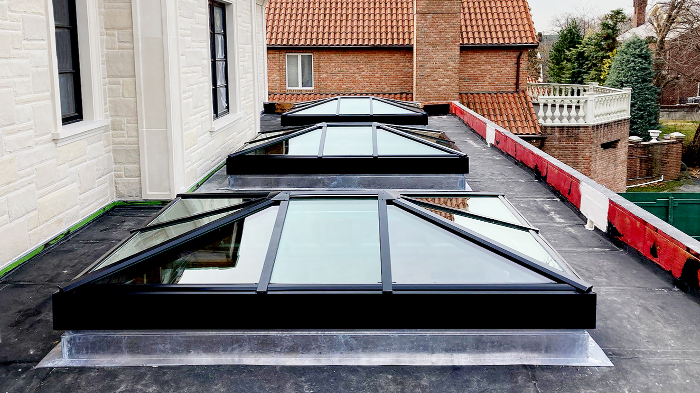 Three straight eave double pitch hip end skylights