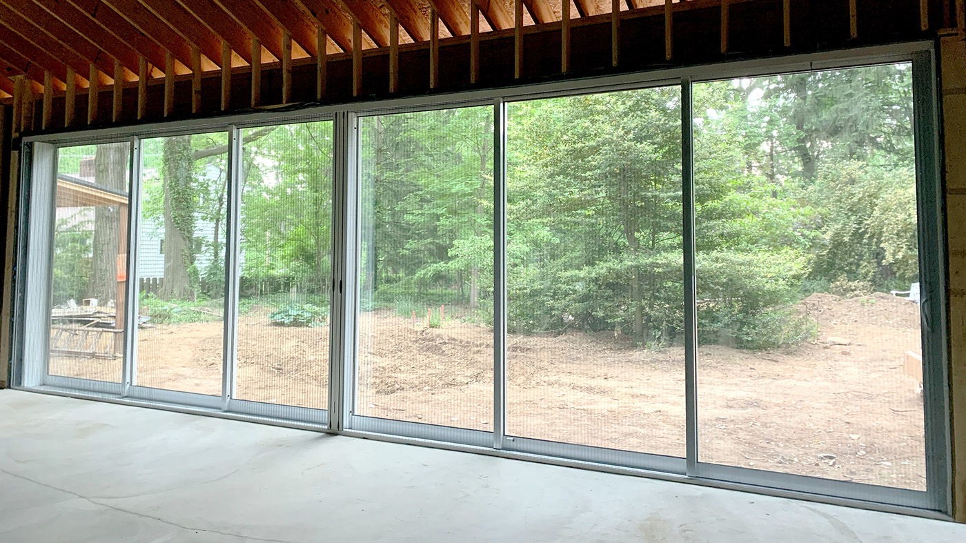 Six panel multi-track sliding glass doors with B-Series screens