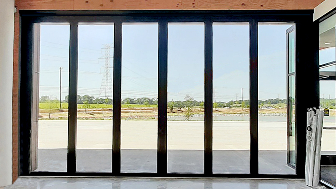 One six panel G3LT outfold split-wall bifold door unit with a door adapter.
