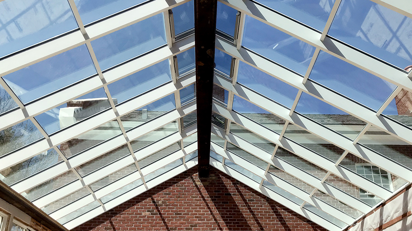 Straight eave double pitch skylight with ridge vents.