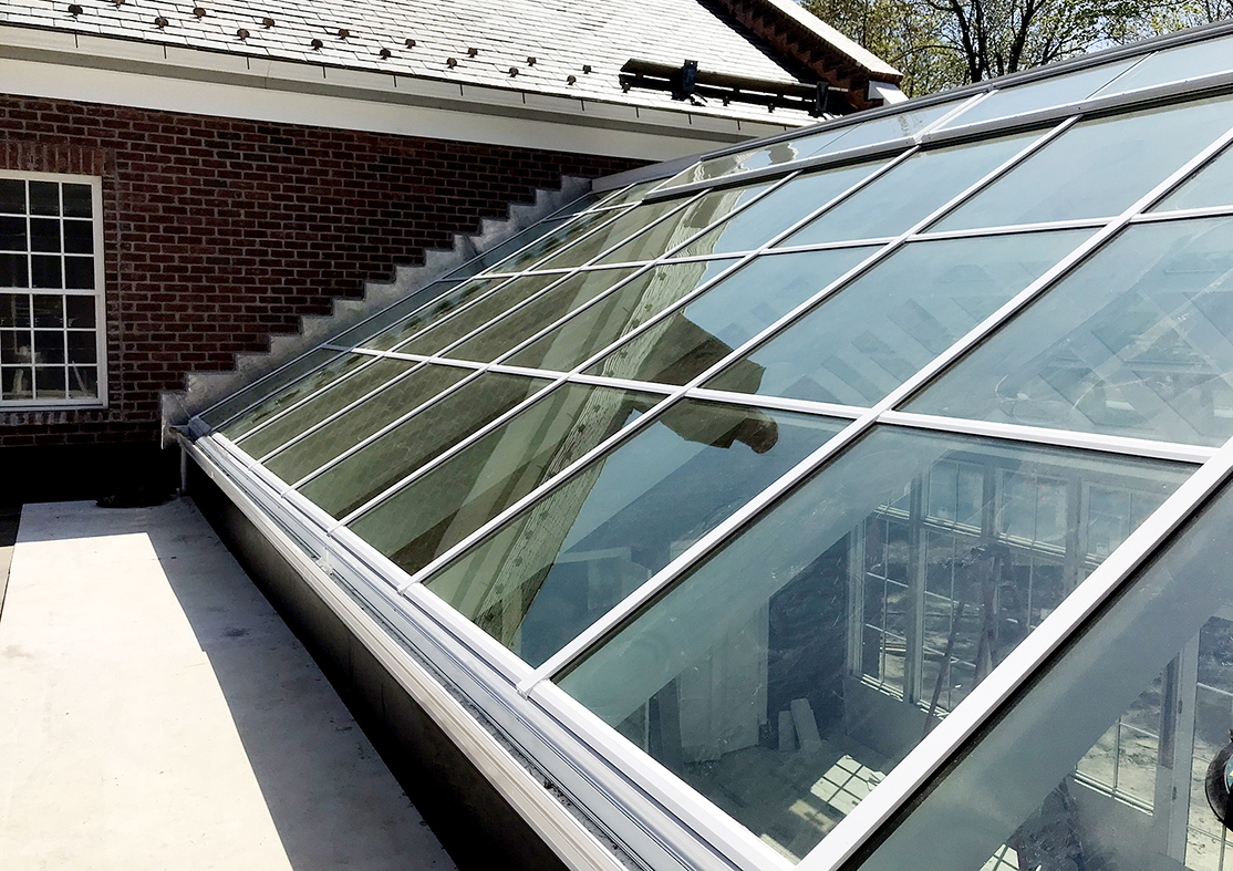 Straight eave double pitch skylight with ridge vents.