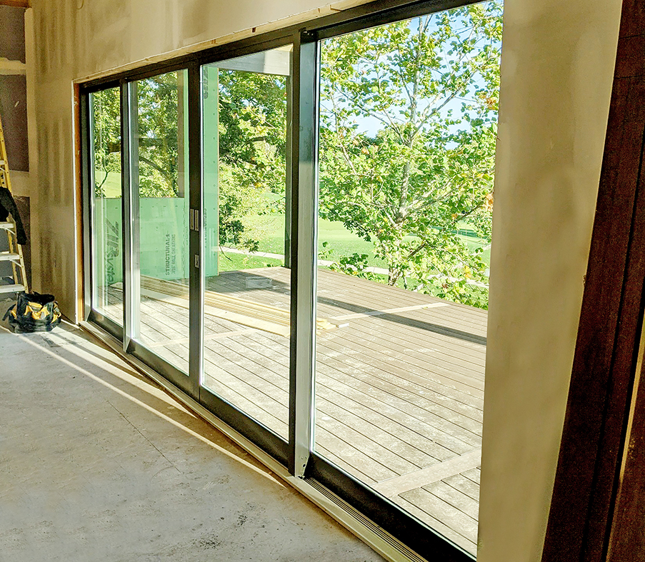 One four-panel multi-track sliding glass door system