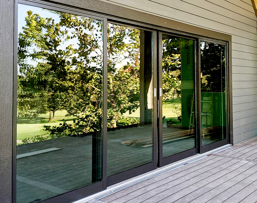 One four-panel multi-track sliding glass door system