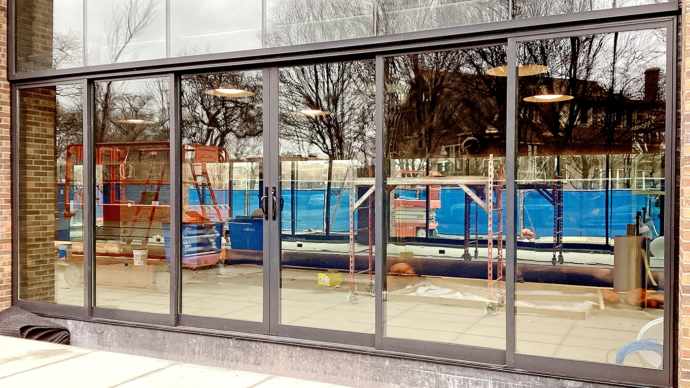 Two six- and one five-panel multi-track sliding glass door systems