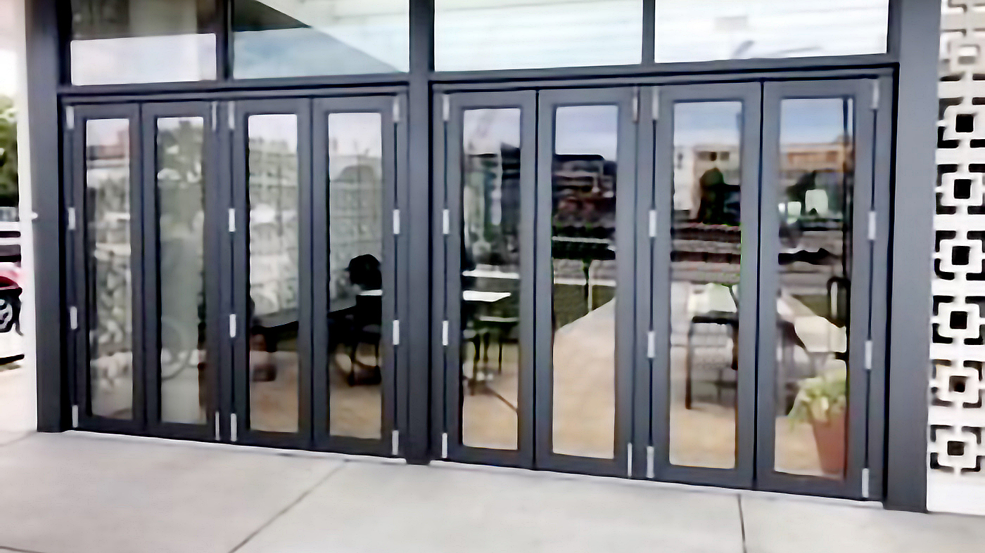 Two four-panel G2 outfold split-wall bifold door units with a floating jamb and door adapter.