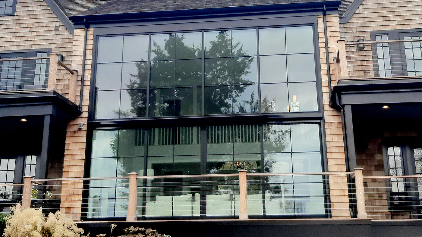 One aluminum curtain wall with an integrated four-panel (OXXO configuration) G2 multi-track sliding glass door unit.