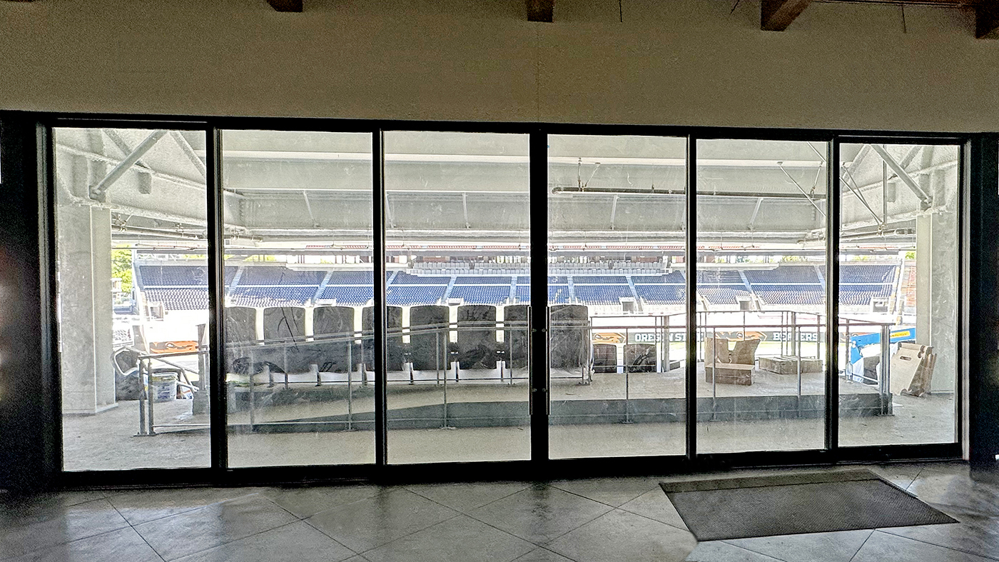 One six-panel (OXXXXO configuration) G2 multi-track sliding glass door unit, and two five-panel G3LT slide and stack window units with horizontal mullions.
