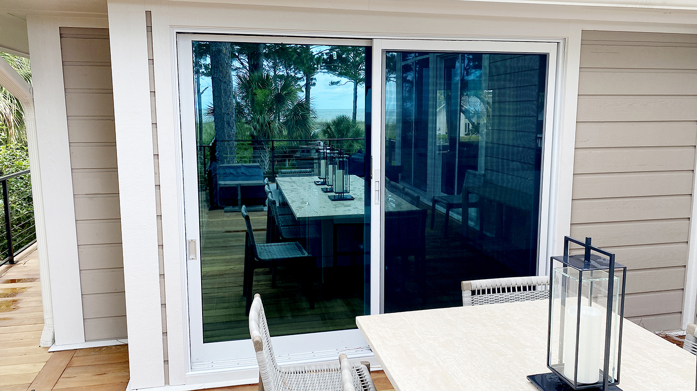 Seven aluminum curtain walls, two of which have integrated two-panel (XO & OX configuration) G2 multitrack sliding glass door units, one four-panel (OXXO configuration) G2 multi-track sliding glass door units, all glazed with LoE 340 insulated glass.