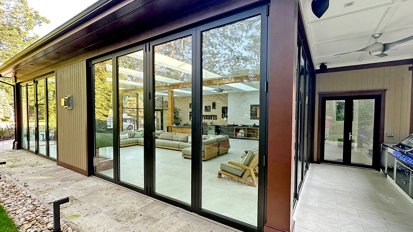 Eight fixed welded curb skylights, two four-panel G3 outfold and one four-panel G3 infold split wall bifold door units, and one aluminum curtain wall with an integrated swing door