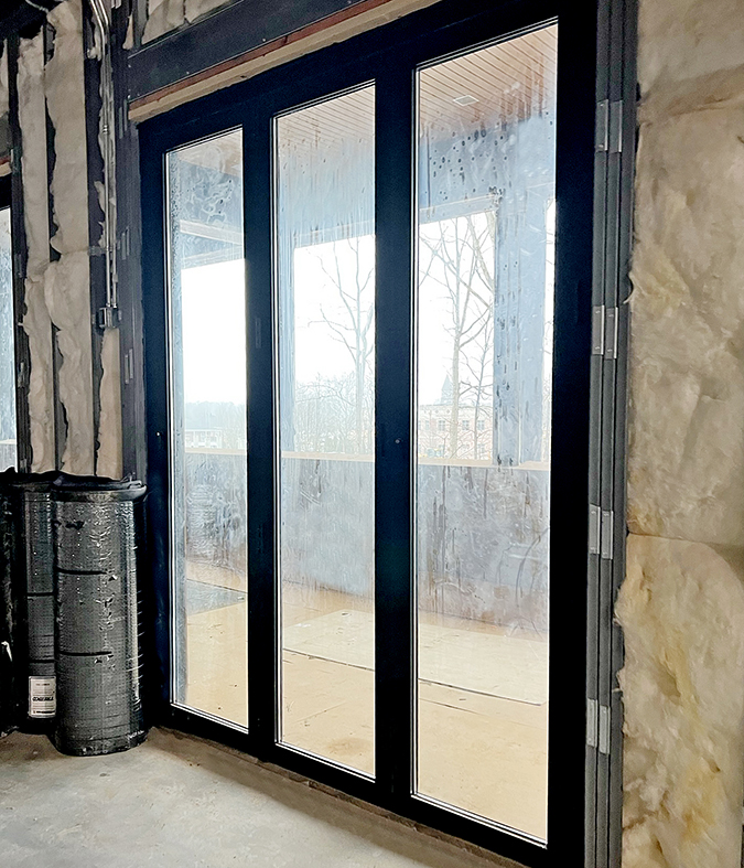 Four three-panel G2 infold all-wall bifold door units.