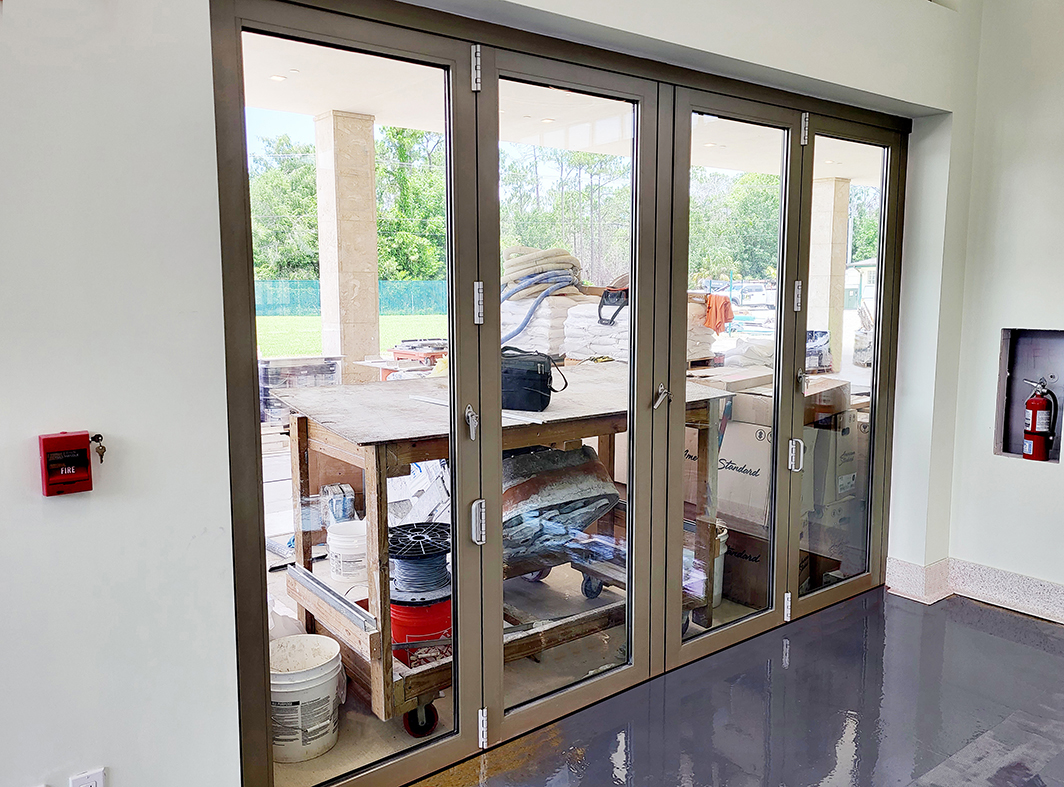 Two four-panel (one split wall, one single door hinged jamb [SDHJ]) outfold bifold door units.