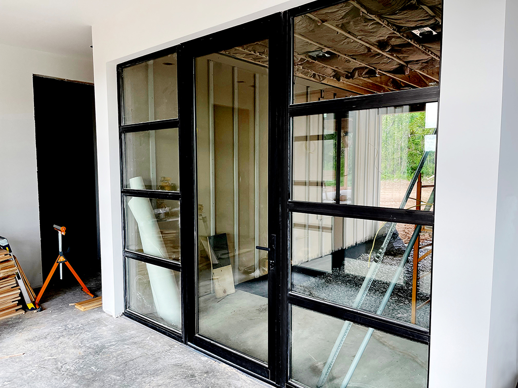 Four G2 fixed windows, three G2 French casement windows, two casement, four aluminum curtain walls, six G2 terrace doors, and two G3 outswing pivot doors.