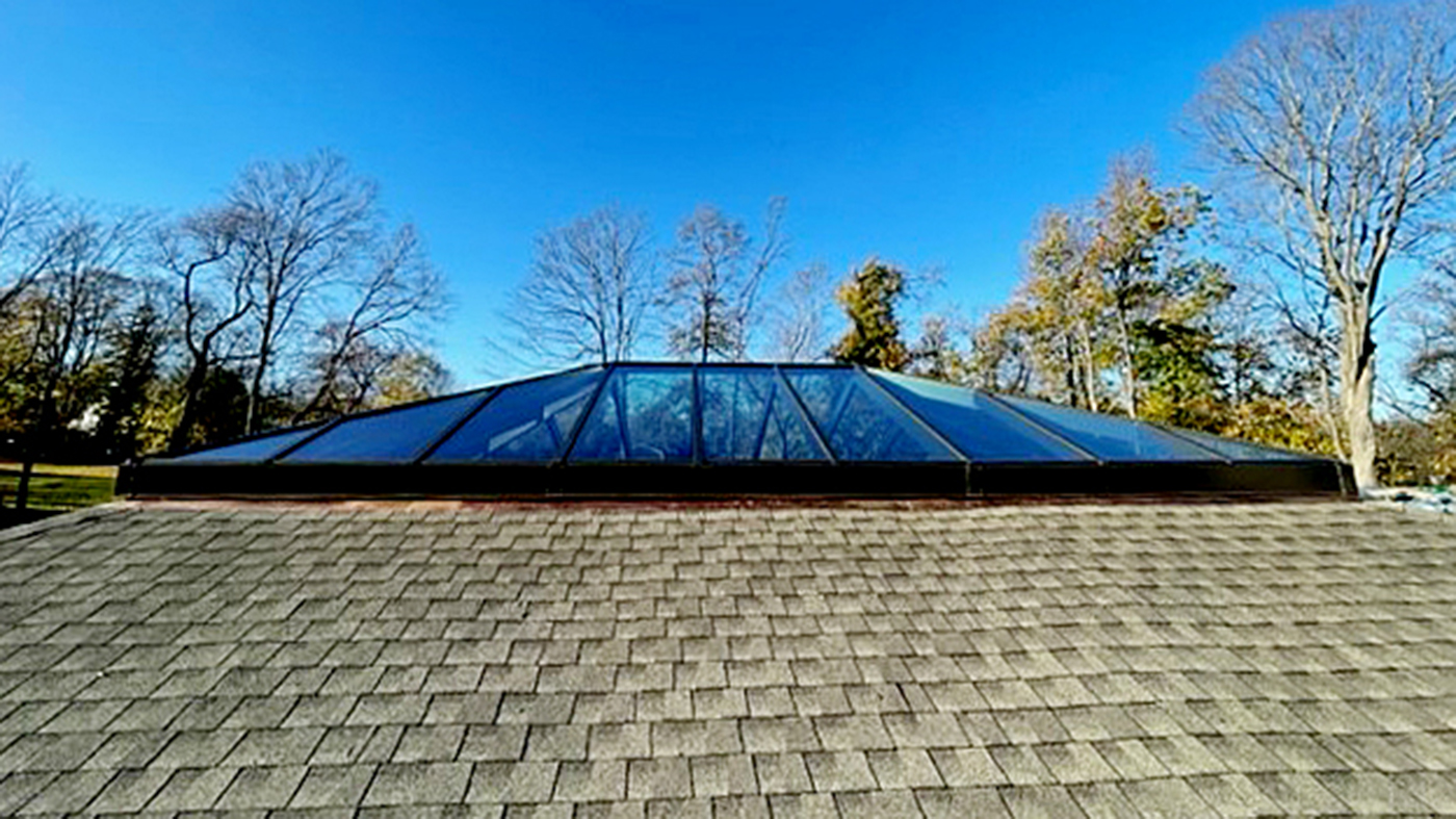 Straight eave double pitch hip end skylight