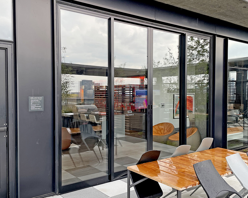 Two four-panel (OXXO configuration) multitrack G2 sliding glass door units.