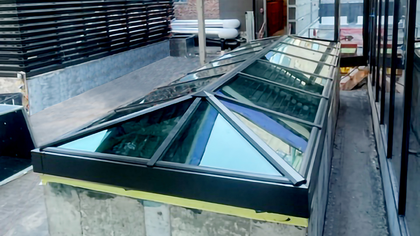 One straight eave double pitch hip end skylight.