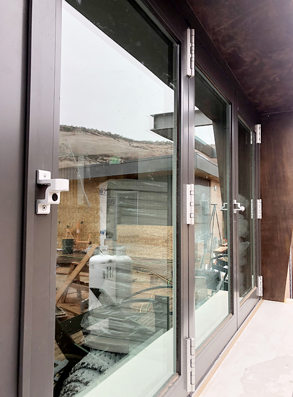 Two six-panel (OXXXXO configuration) G2 muti-track sliding glass door units and one six-panel G2 No corner post bifold window unit.
