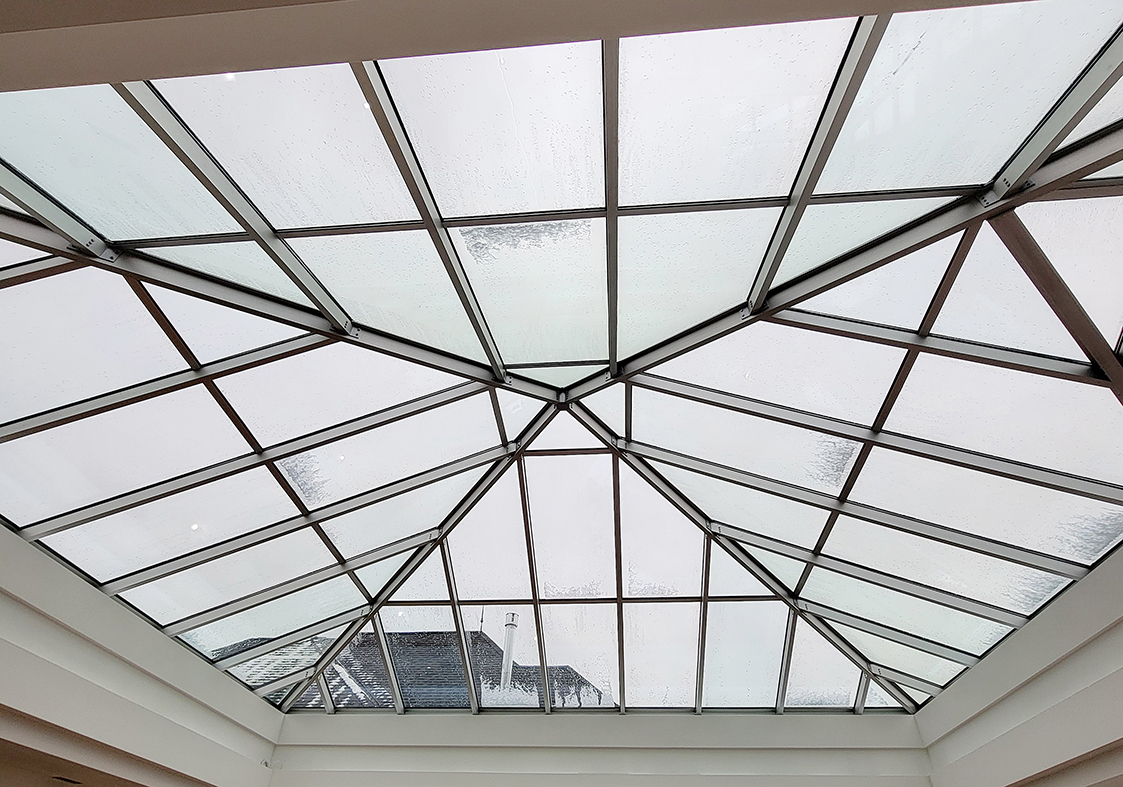 One pyramid skylight with a hip-end extension.
