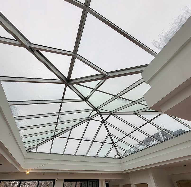 One pyramid skylight with a hip-end extension.