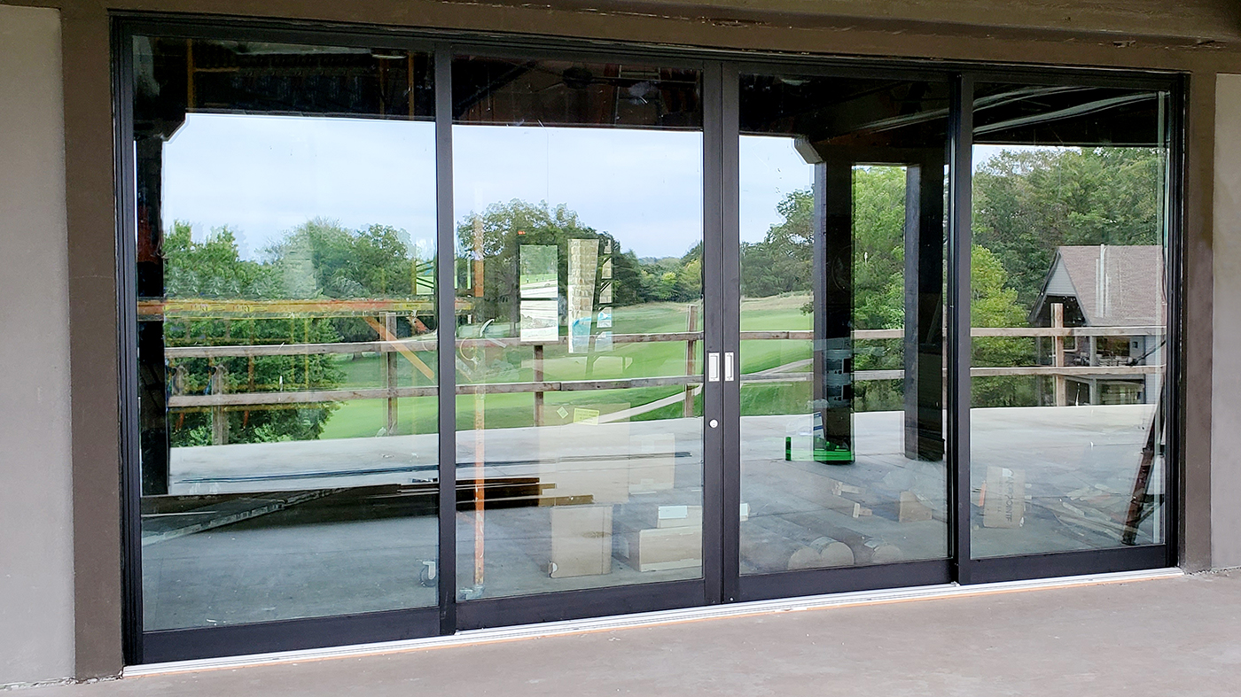 One four-panel (OXXO configuration) and two two-panel (XO configuration) G2 multi-track sliding glass door units. 
