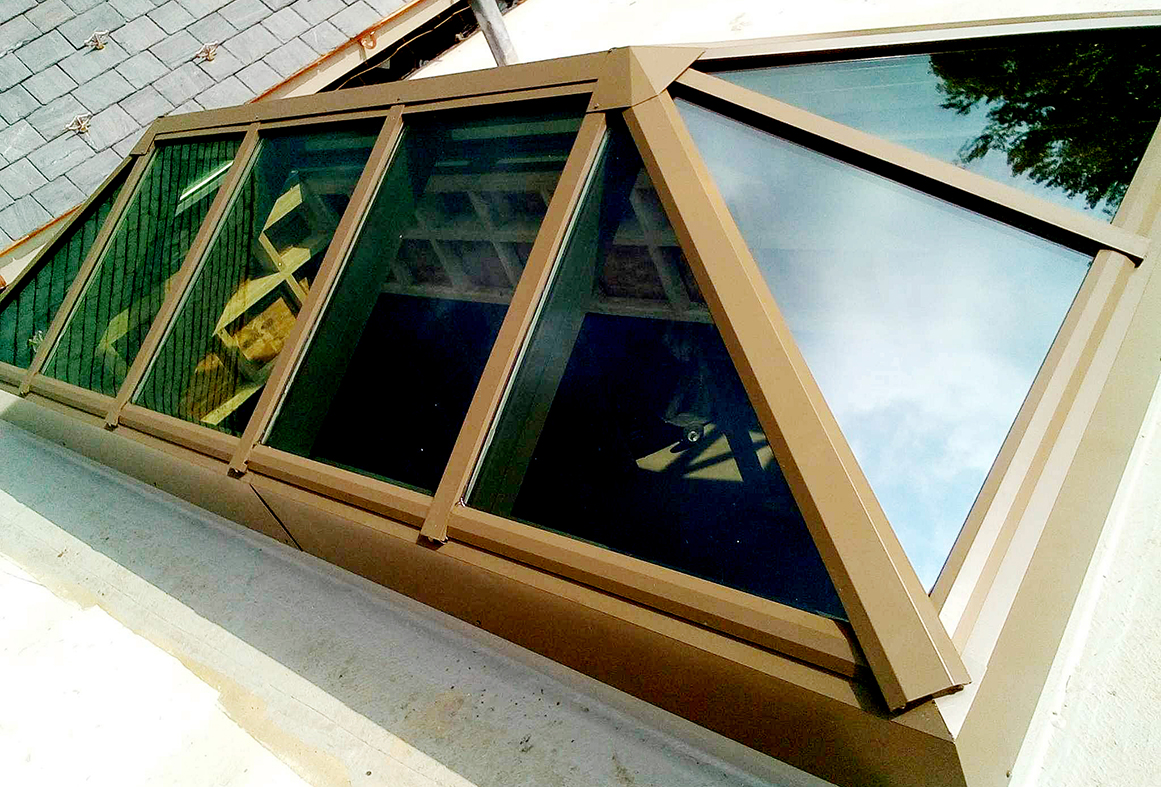 Three straight eave double pitch hip-end skylights