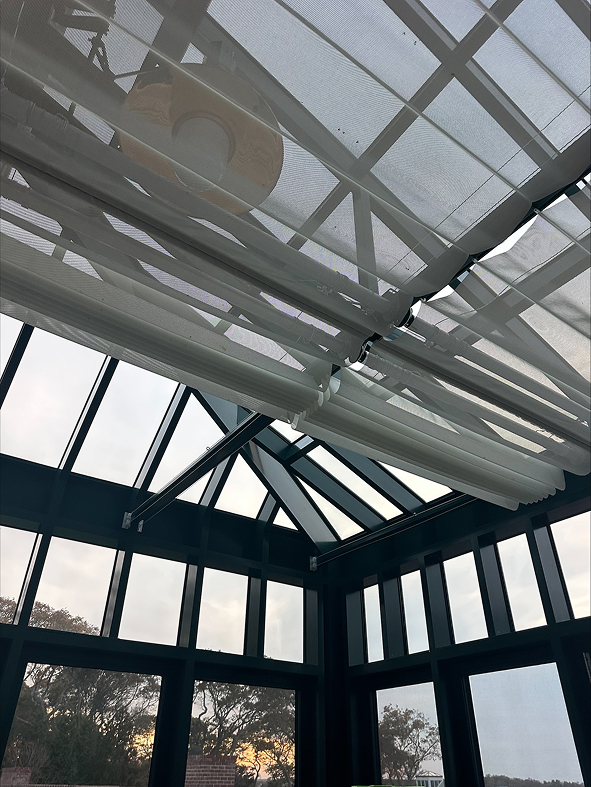 Straight-eave lean-to greenhouse with two hip ends, cold frames, 10 awning windows, and one terrace door.