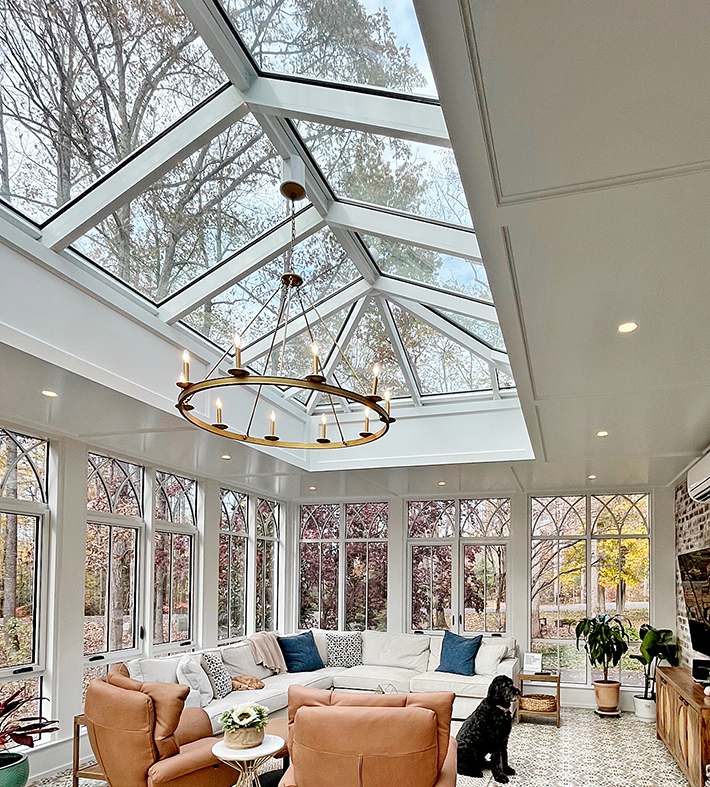 One straight eave double pitch hip end skylight and two aluminum curtain walls, one with integrated casement window.